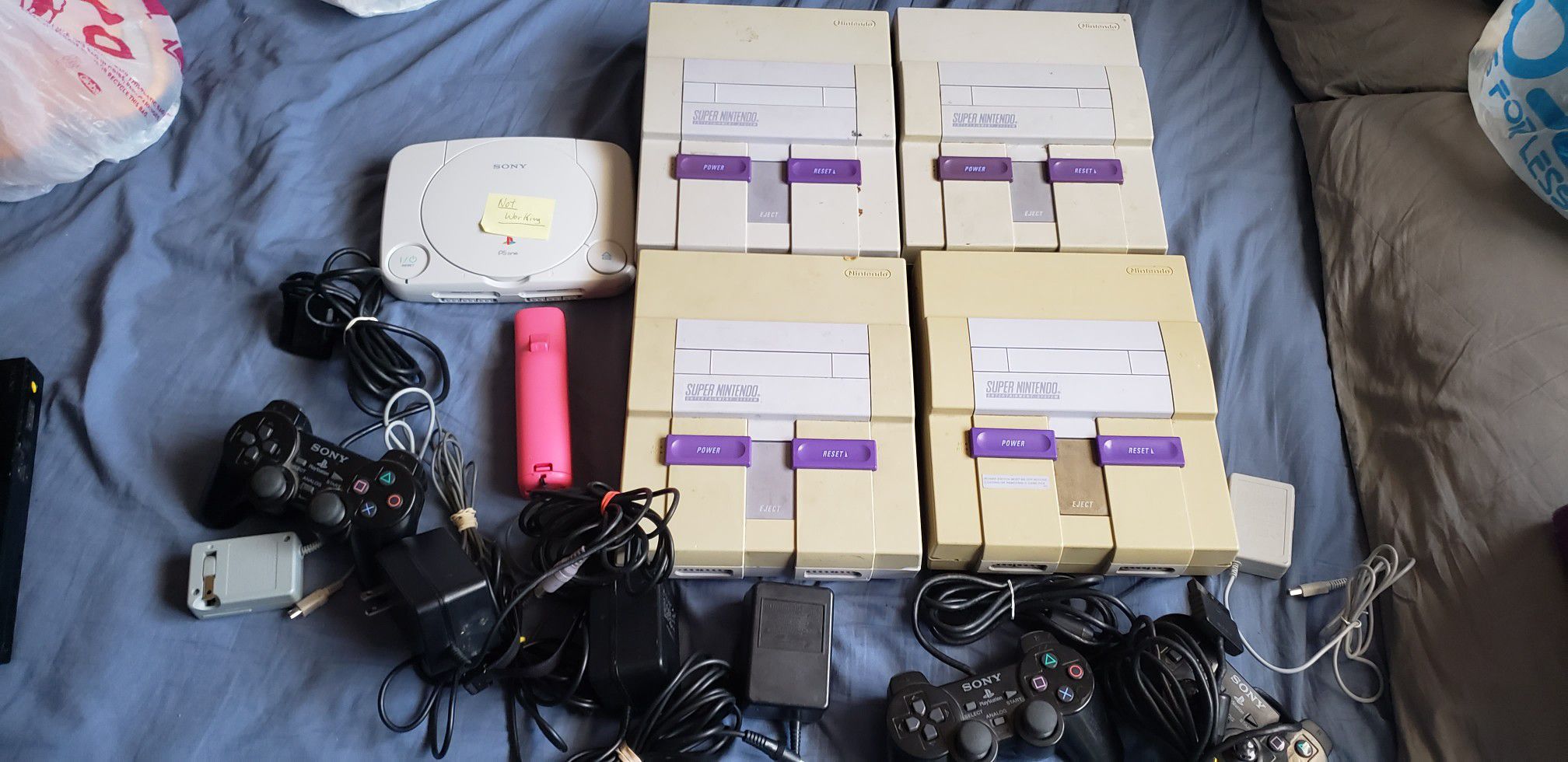 Super Nintendo and Playstation 1 and 2 systems controllers and different systems for parts for $60