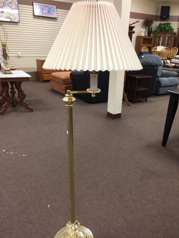 Solid brass swivel top pole lamp