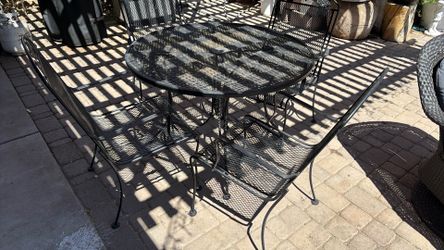 Metal table with chairs