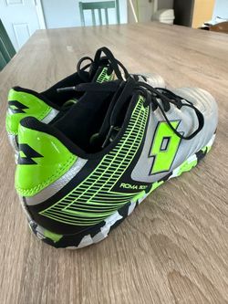 Selling a used green Lotto soccer cleat (size 6) in excellent condition. With the purchase, you also get a used white Lotto cleat (size 6, no laces) a