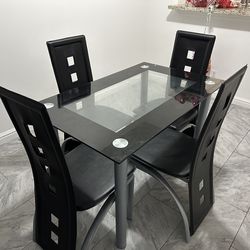 Dining table w/ four chairs included