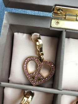Gold and pink juicy couture peace heart charm
