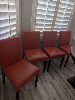 Crate and barrel Lowe Persimmon Leather dining Chairs, set of 4