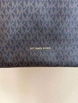 Brown Michael Kors tote with gold accents.