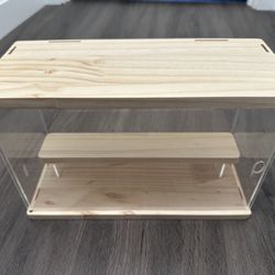 acrylic and wood display case with a shelf. 