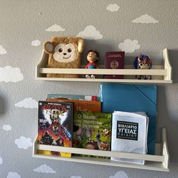2 White wooden shelves mounted directly to wall