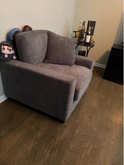 Single couch non reclining like new with pillow cushion