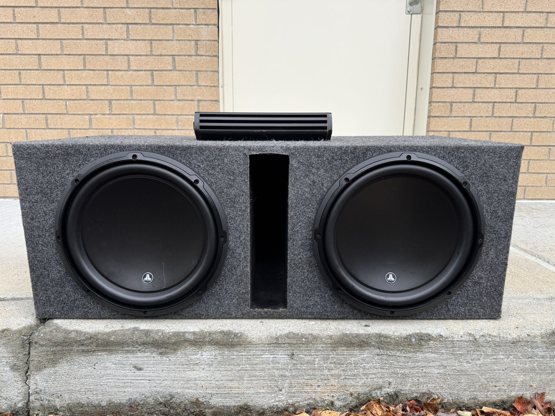 2 12"JL audio W3v3 in ported box and Kicker Cx1,200w Mono amp