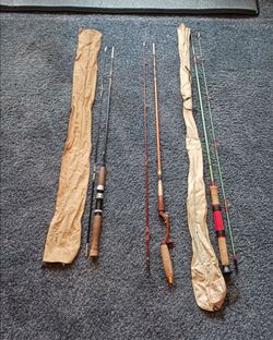 Three vintage fishing rods