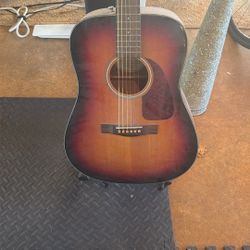 fender acoustic guitar and stand
