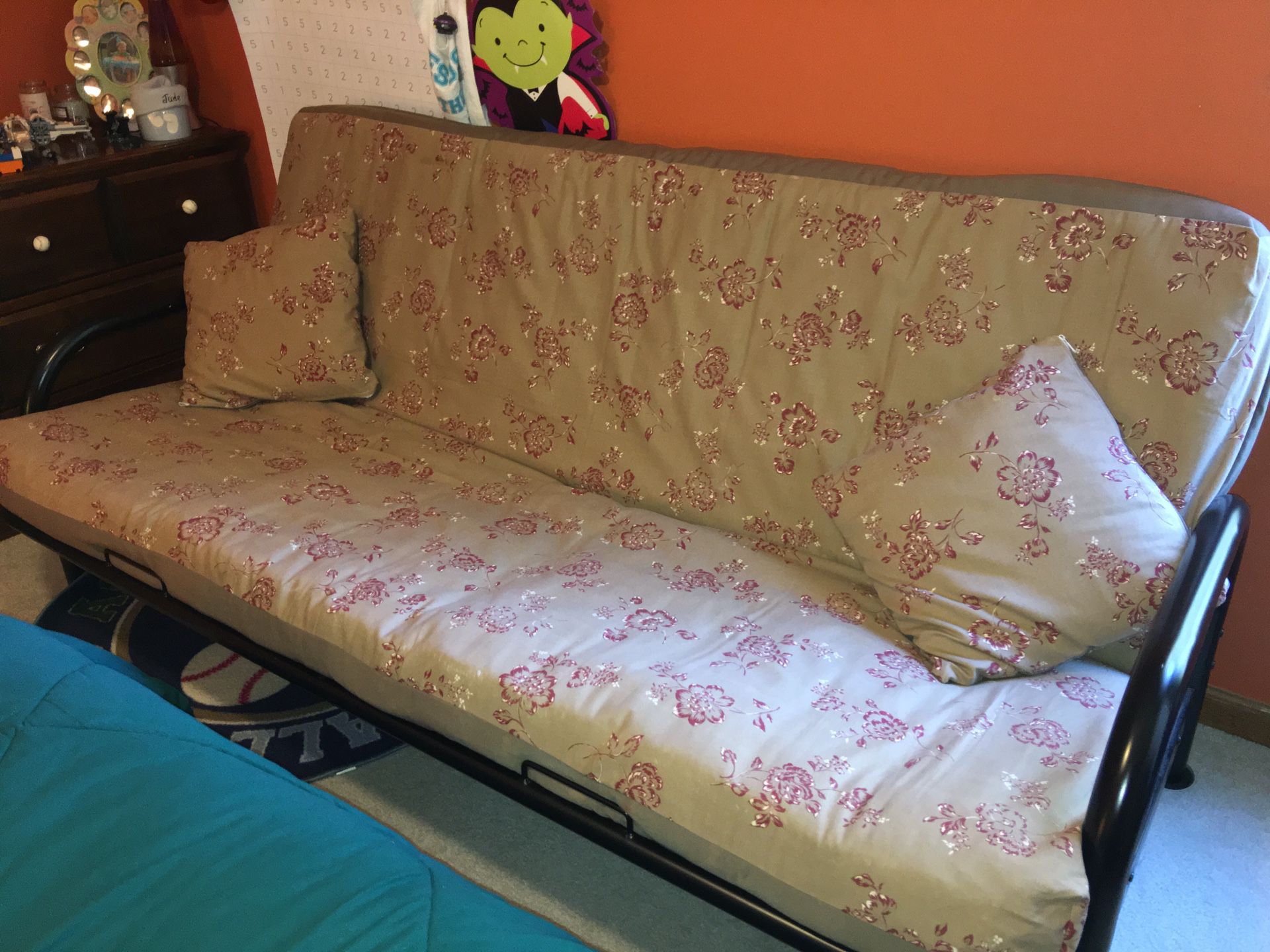 Futon with upgraded mattress, cover and matching pillow slips.