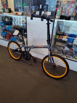 PREOWNED RETROSPEC JUDD 20 MATTE GRAY ORANGE SINGLE SPEED COASTER BRAKE ALUMINUM FOLDING BIKE