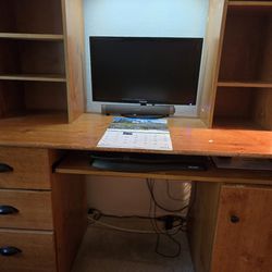 Desk for computer work or whatever you'd like, along with a comfortable chair on wheels
