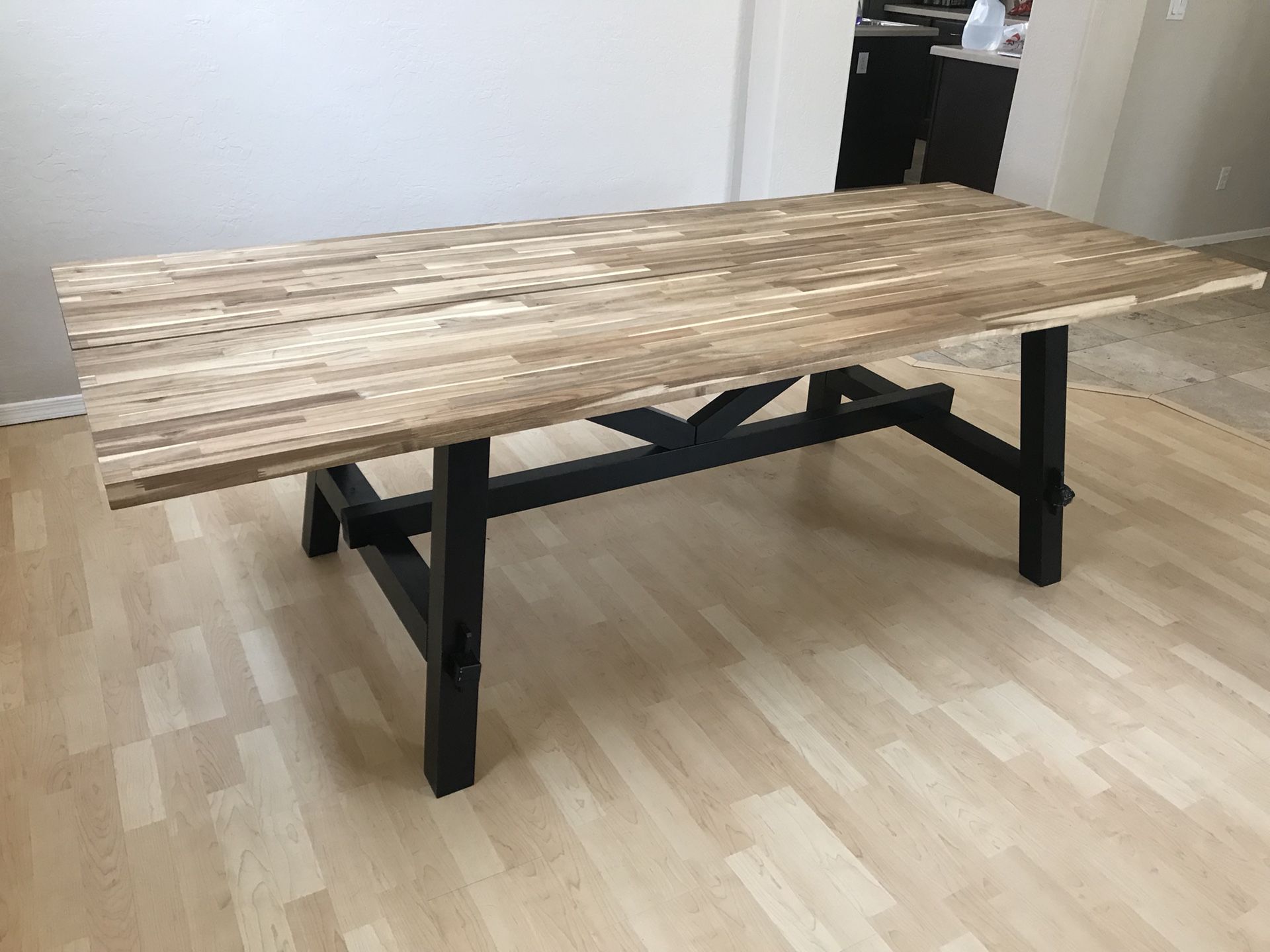 IKEA skogsta dining table. Originally 450 selling for $200.00.