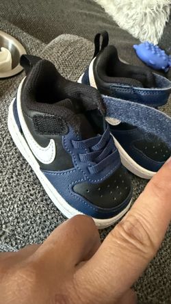 Blue and black Nike shoes