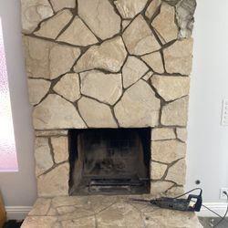 Stone rock fireplace meticulously taken apart