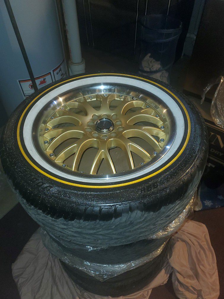 Vogue Tires Sitting On Gold And Chrome Rims