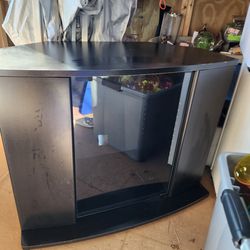 Black TV Stand With Open Up Doors And Open Up Glass Door For Storage. 