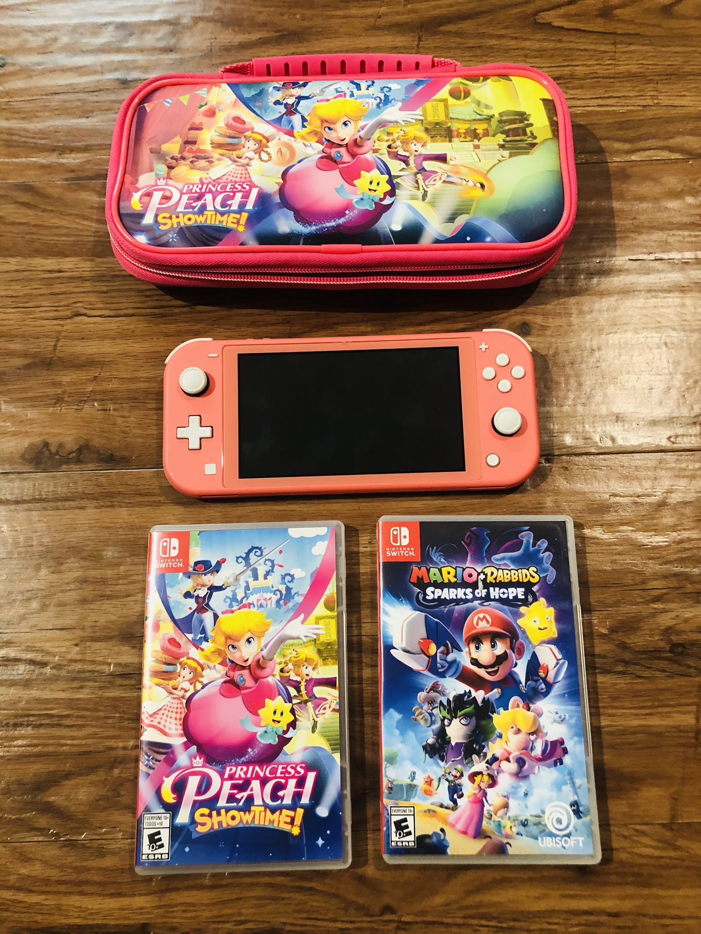 Switch Lite Nintendo Switch Lite w/ carrying case + 2 Mario Games