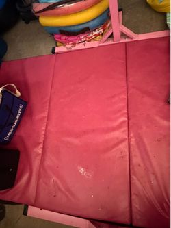 Pink Gymnastics bar and mat