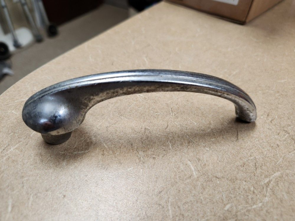 USED INTERIOR DOOR HANDLE FOR A 1948 CADILLAC