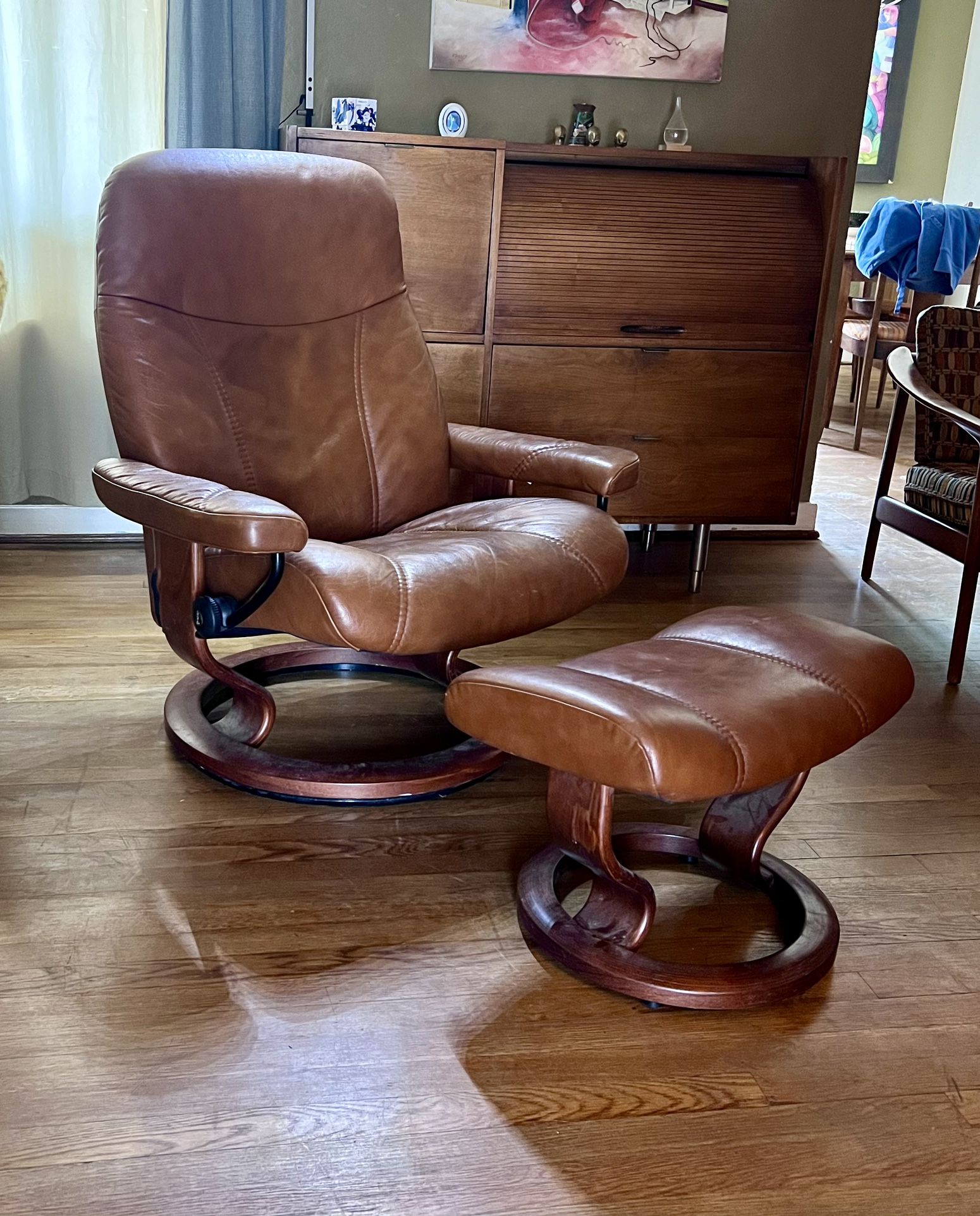 Ekornes Stressless Caramel Leather Swivel Recliner and Ottoman .