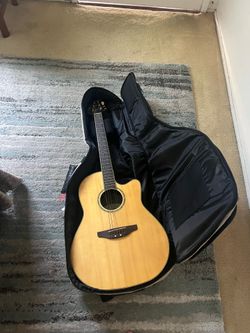 Ovation electric acoustic guitar with case