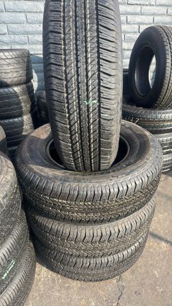 FOUR GOOD USED TIRES 95%TREAD LIFE.  265/70/17 BRIGESTONE DULER 