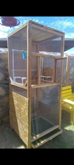 Wood made bird house with easy bottom wheel's and bottom tray