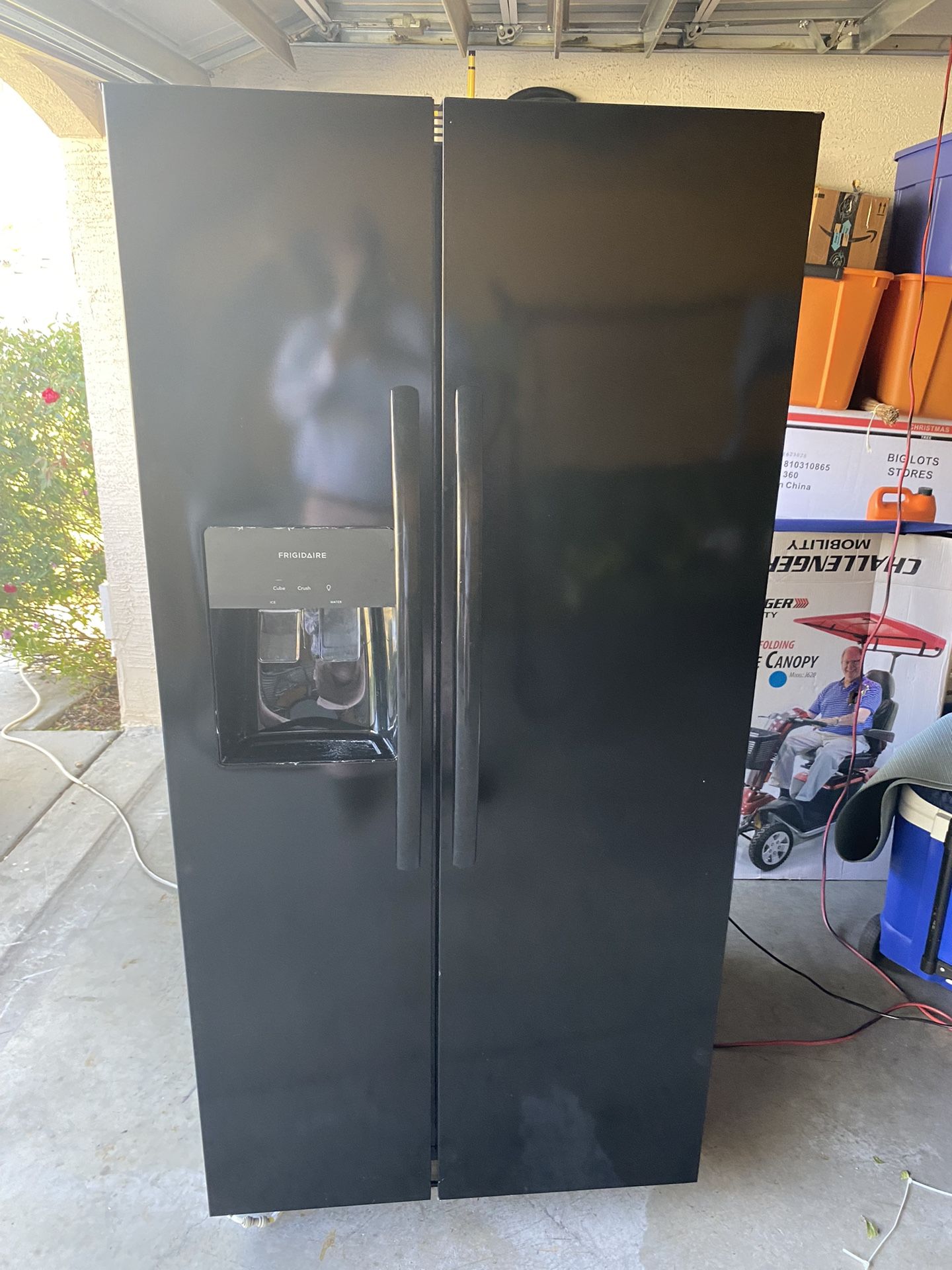 2023 Model Black 25 Cubic Feet Side by Side Refrigerator in like NEW condition