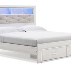 Altyra White King Upholstered Platform Bookcase Bed with Storage