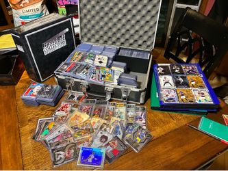 Three binders and case over 1000 cards