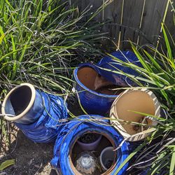 4 blue plant pots