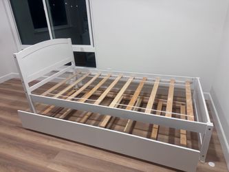 White twin bed base with matching trundle
