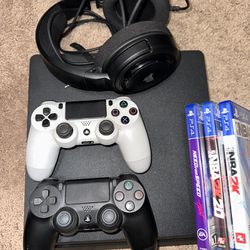 PS4 with 2 Controllers headphones 2 Games