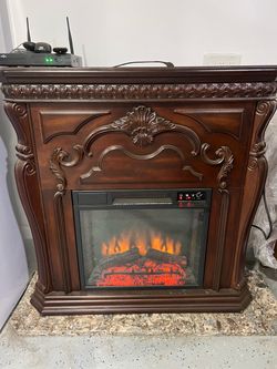 Electric Fireplace with Ornate Wood Mantel