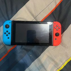 NINTENDO SWITCH WITH MEMORY CARD AND GAMES