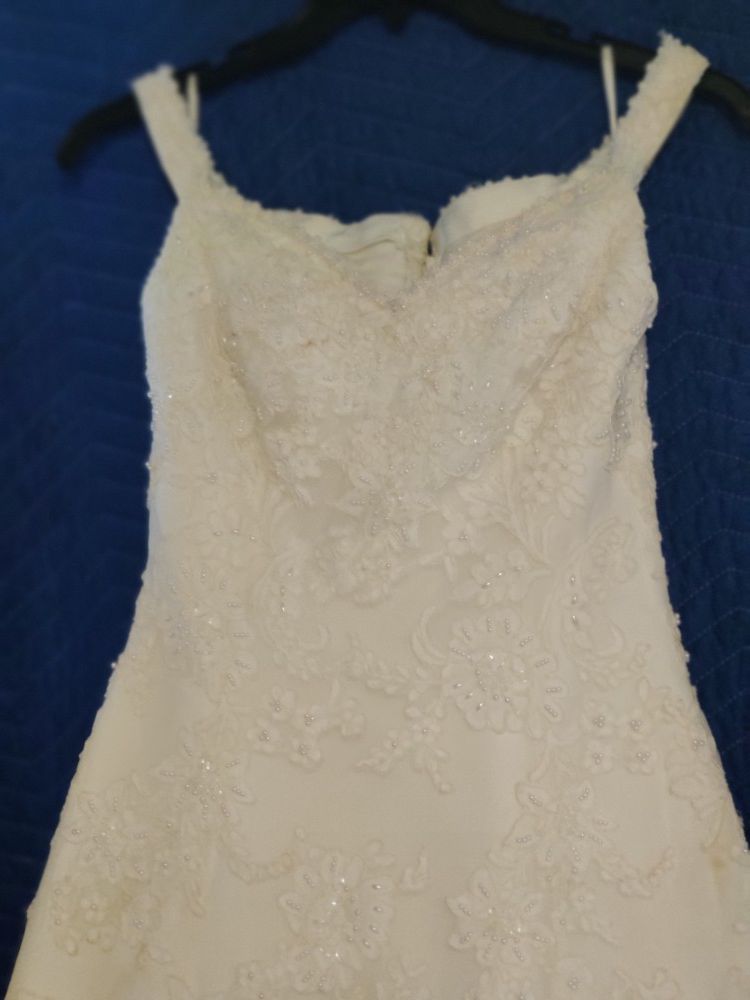 87 Views! Going to salvation army soon. Demetrios off white beautiful wedding dress, size 10