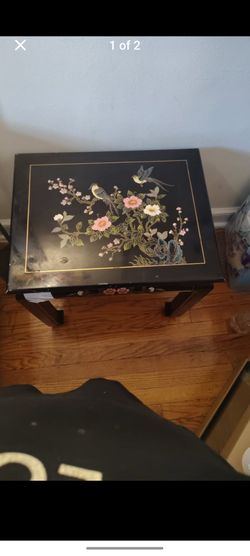 black end table with floral design