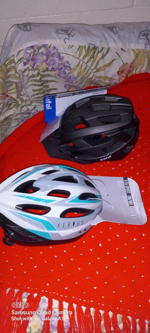 2 New With Tags Adult Helmets Sizes Are In The Pictures $20