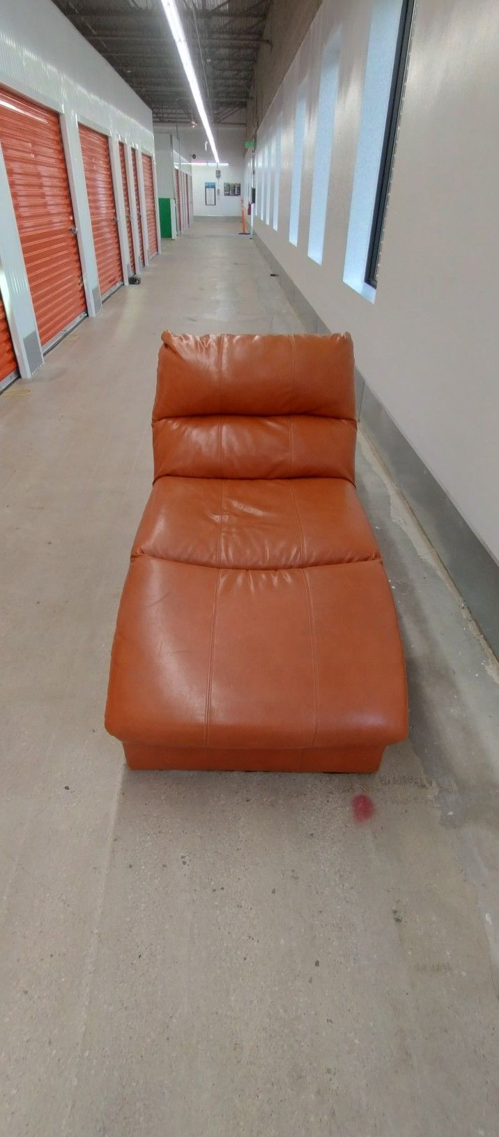 Orange Faux Leather Chaise Lounger. 