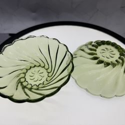 Set of (2) vintage Hazel-Atlas Colonial Swirl green glass bowls, also known as Capri, features a scalloped edge and a swirl design, early 1950s or 196