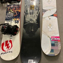 Three Snowboards Elan Burton And Santa Cruz