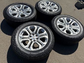 20” new take off Chevy Silverado rims with good used tires all terrain