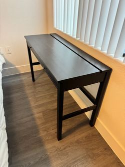 Black desk with drawers