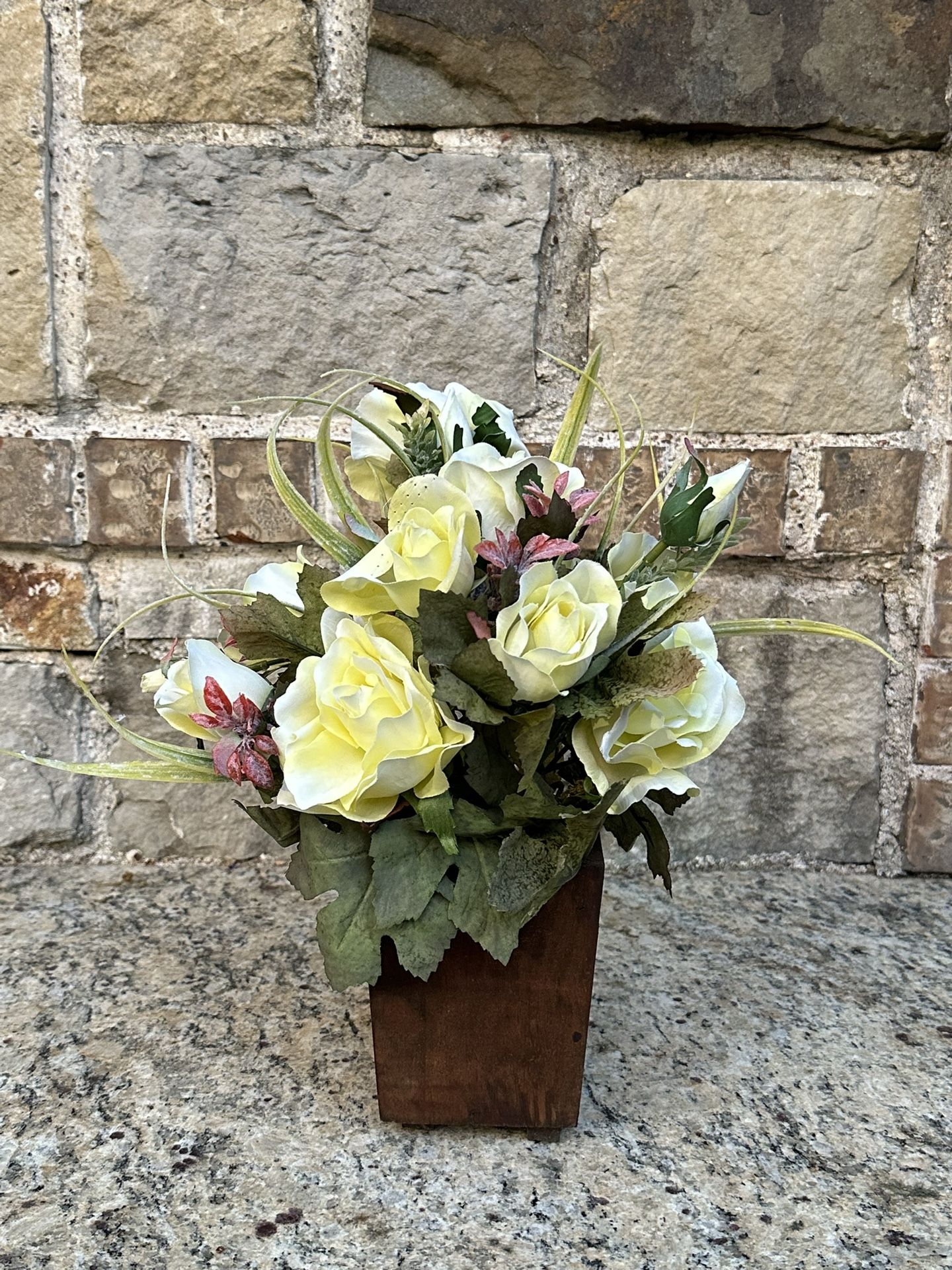 Celebrating Home floral arrangement of Roses on wooded pot