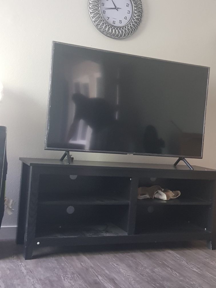 Samsung 55 inch tv with the tv stand 350 with free delivery have to go today only used 6 months