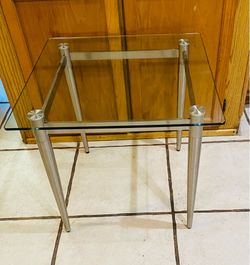 Glass top end table. Read description for details and location.