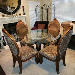 Elegant high end round glass table and chairs. Michael Amini