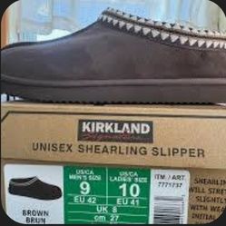 New in box Kirkland Signature Unisex Shearling Slipper. Have Brown and Black.Sells at costco for $35